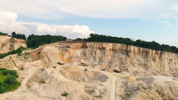 Large Industrial Sand Quarry. Equipment That Works in a Sand Quarry. The Mountain From Which Sand Is