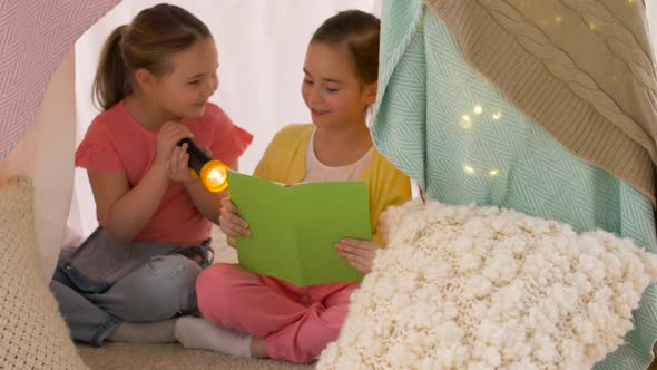 Happy Girls Reading Book in Kids Tent at Home