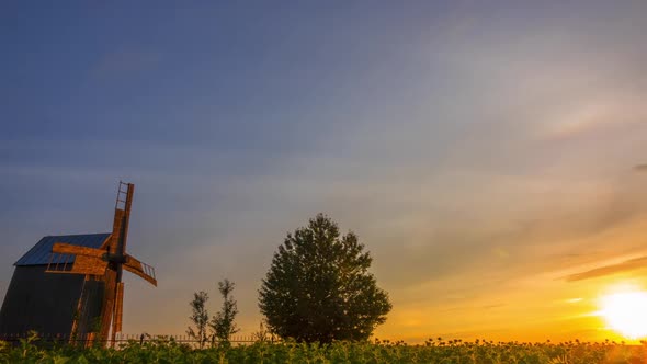 Sunset and an Old Wooden Windmill