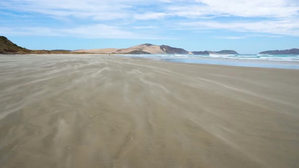 Sand is Moving in a Wind in Ocean Beach Coast