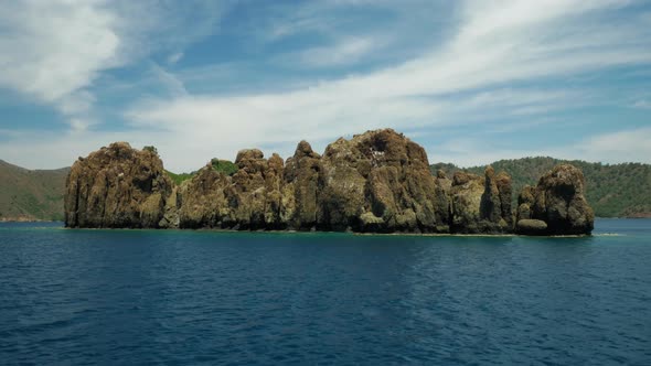 Volcanic rocks located in the open blue sea