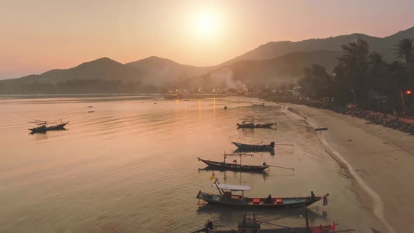 Aerial View Sunset Over Sea Beach Fishermen's Boats Near Shore Golden Hour