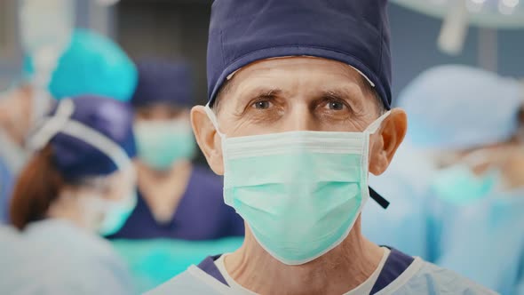 Portrait of mature surgeon at operating room