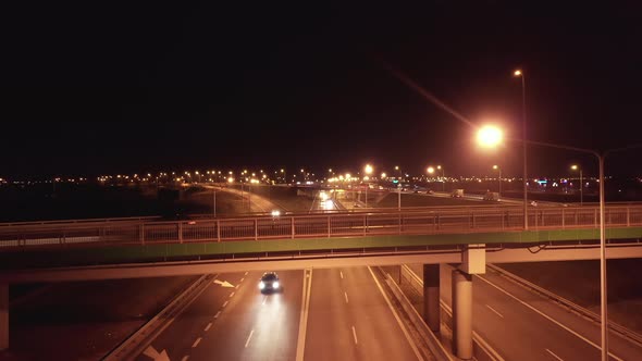 Highway and Junctions with Bridges and Car Traffic at Night