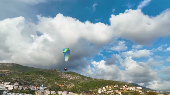 Aerial view 4 K parachute jumper flying over beautiful Alanya