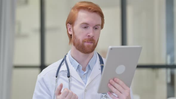 Portrait of Video Chat on Tablet By Redhead Male Doctor