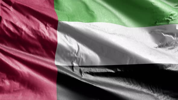 United Arab Emirates textile flag waving on the wind. Slow motion. 20 seconds loop.