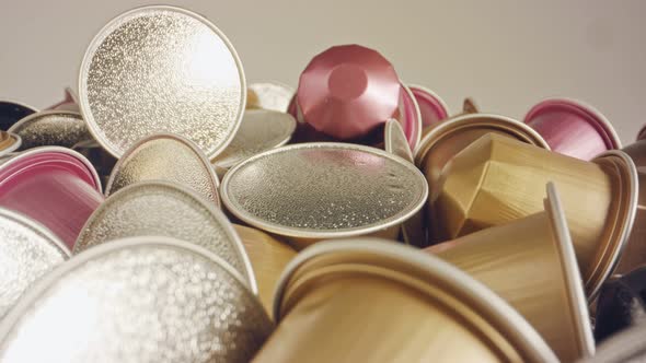 Macro shot of espresso capsules in various colors and flavors