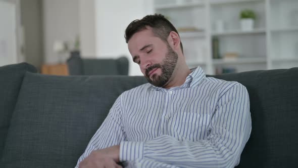 Young Man Waking Up From Nightmare at Home