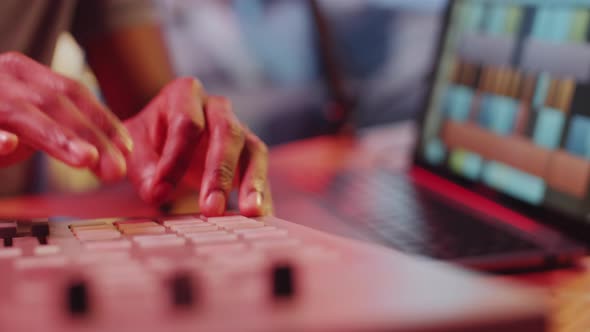 Hands of Male Sound Producer Working on Mixing Console in Recording Studio