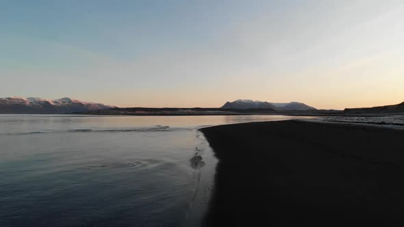 Twilight Above Black Sand Beach on Coastline of Iceland. Drone Aerial View