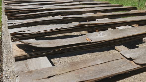 Old Withered Boards Lie One After Another in the Sun