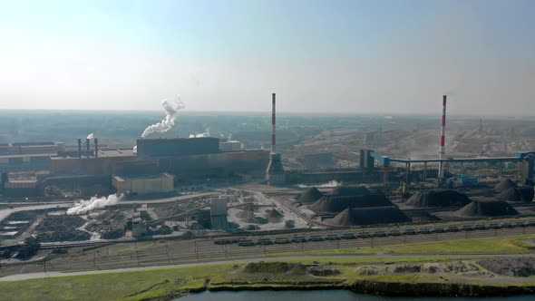 Timelapse of an Industrial Area With Chimneys and Smoke