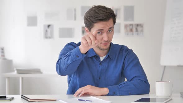 Casual Adult Man Pointing with Finger Toward Camera