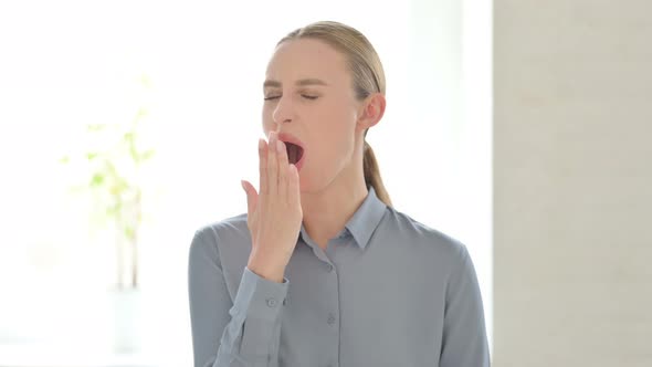 Portrait of Sleepy Woman Yawning