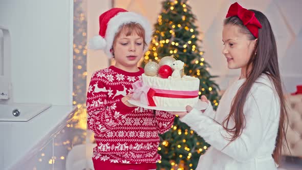 Happy Kids Girl and Boy Making Homemade Cake for Christmas at Light Home Interior