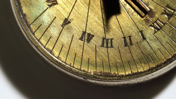 Dial of a Solar Watch Rotate on a White Background. Close Up