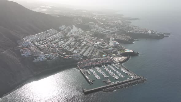 Los Gigantes Small Village at Steep Huge Cliffs Rock Wall Bordering the Blue Atlantic Ocean Panorama