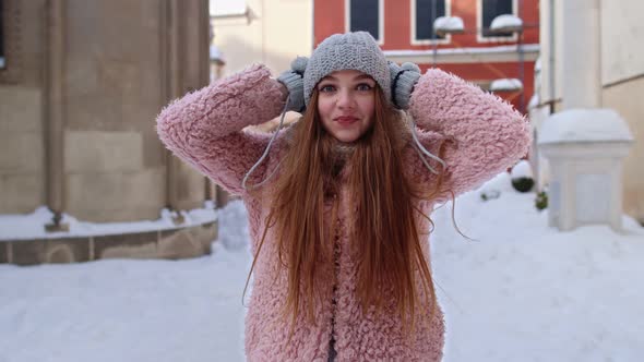 Excited Young Woman Looking To Camera Opening Her Mouth in Amazement Shouting Wow on City Street