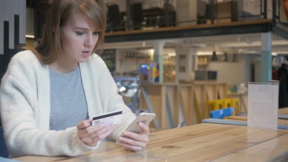 Upset Woman Reacting to Fail Online Shopping on Smartphone