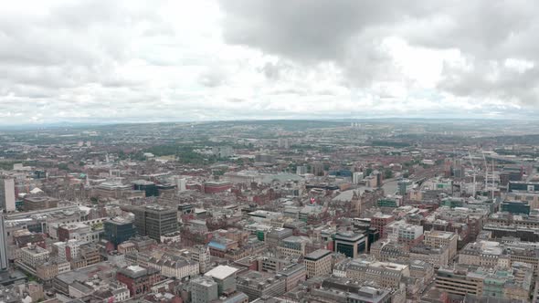 Rising dolly forward drone shot over Central Glasgow city Scotland