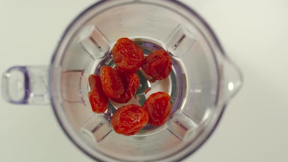 Dried apricots fall into mixer