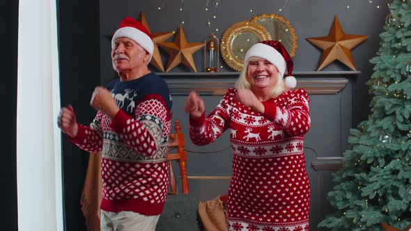 Elderly Family Couple Grandmother Grandmother Dancing at Decorated Home Room with Christmas Tree