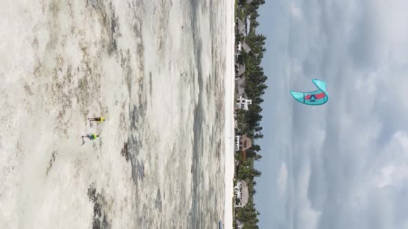 Zanzibar Tanzania  Vertical Video Kitesurfing Near the Shore of Ocean Slow Motion