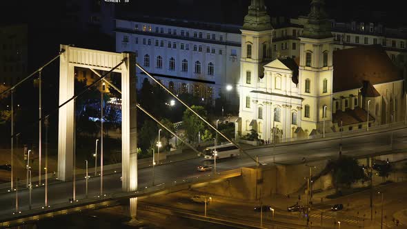 Evening view of Chain Bridge and illuminated Saint Stephen's Basilica, Hungary