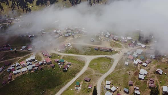 Misty Aerial View Of High Mountain Village