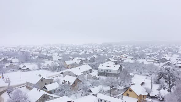 Aerial Panoramic View Above a Small Town Covered in Ice and Snow