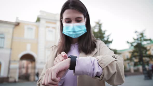 Young Tourist Woman Looking on Smart Watch Near Airport