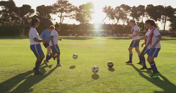 Side view of female soccer team training 4k