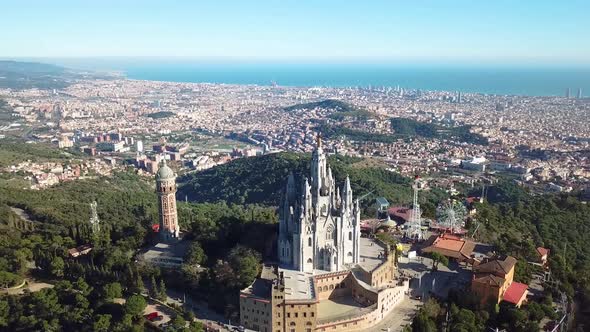 Barcelona Drone Shot Of Tibidabo Church Amusement Park. Sunny, Blue Sky Day.