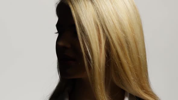 Blond Female Model with Her Long Hair. White