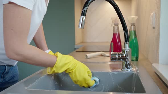 Woman Cleaning Kitchen Sink Daily Chores and Housework