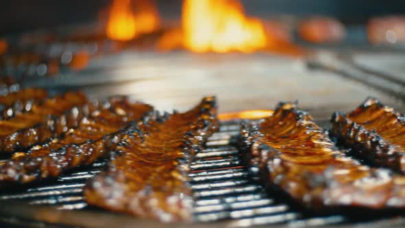 Pieces of Ribs with Meat Fry on Fire