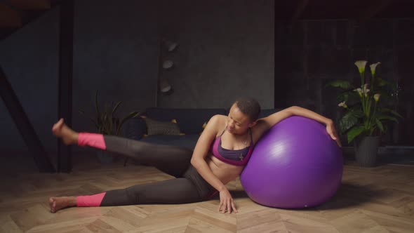 Fitness Woman Doing Stability Ball Side Leg Lift
