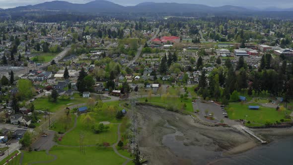 Aerial View Of Evergreen Rotary Park In Bremerton, Washington With Mountain Landscape In Distant Bac
