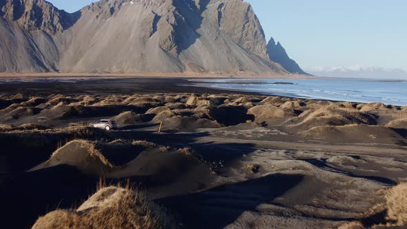 Drone Over Black Sand Beach Towards Tide And Vestrahorn