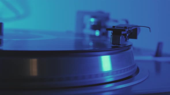 A Vinyl Record Spins in the Gramophone Music Player and Plays an Old Disco