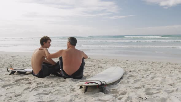 Father and young adult son enjoying outdoor activities together