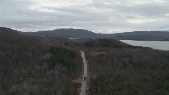 Country road snaking through rural landscape of Northern Norway; drone