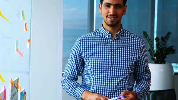 Smiling male executive in office