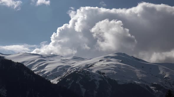 Soft Curved Mountain Ridge and Snowy Summits in Winter