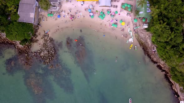 Aerial jib down shot of the Praia da Sepultura, a popular destination in Bombinhas, Brazil