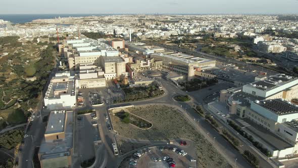 Drone Aerial shot circling around Malta's main hospital - Mater Dei