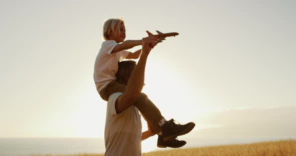 Taking a ride on dads shoulders alt