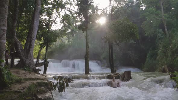 Man Lies In A Waterfall Formed