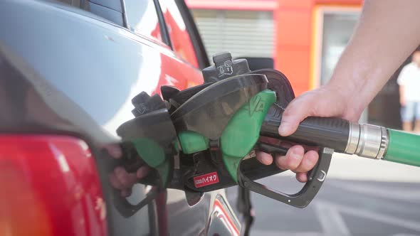 Man of Petroleum Gasoline Station Service. Oil Refueling and Refilling for Car Transportation